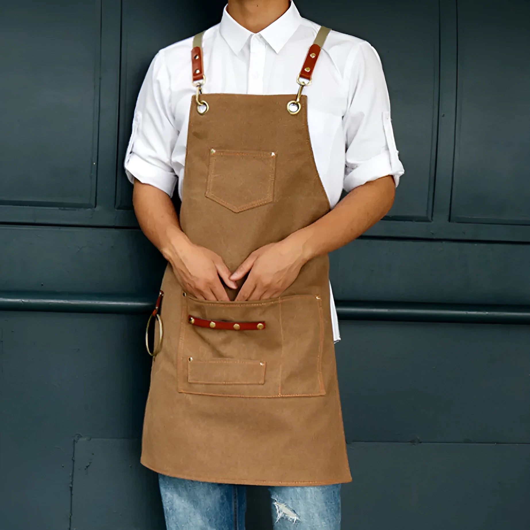 Canvas work apron with cross-back straps in camel colour for cafe and baking use