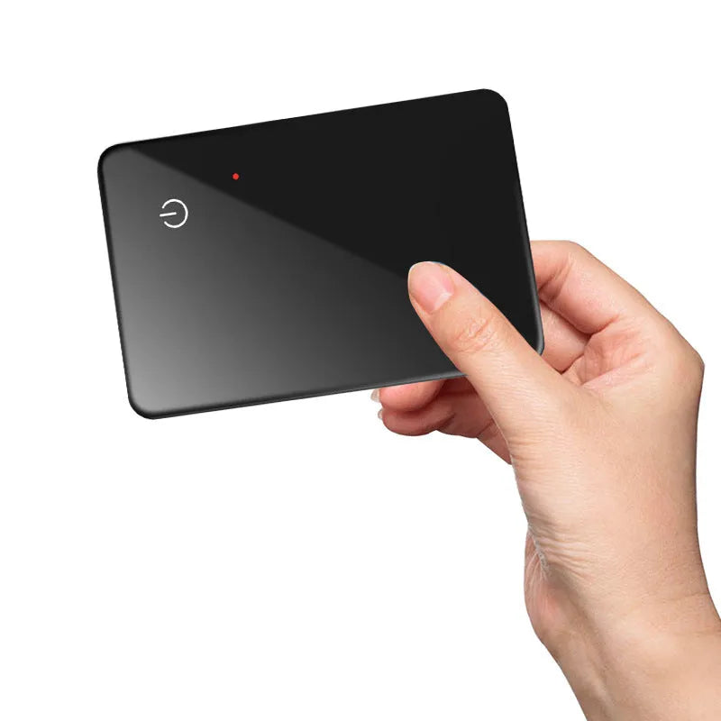 Black pet tracking device with wireless charging and NFC features measuring 85mm by 54mm