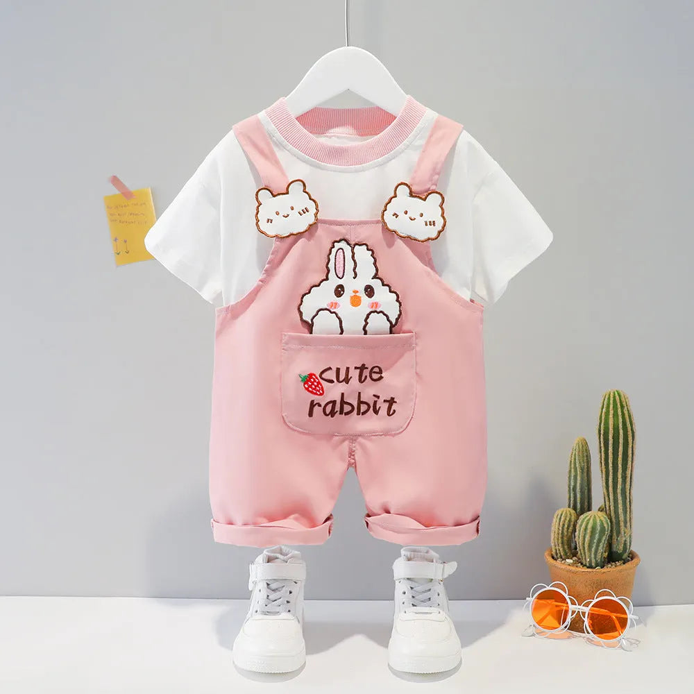 Cotton baby overalls with cartoon print in khaki colour, showing front opening with straps and short sleeves