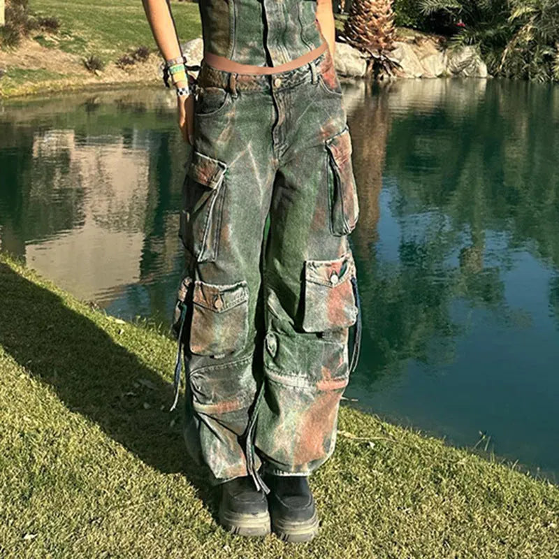 Loose blue denim cargo trousers with gradient colour pockets and a colour bloom wash