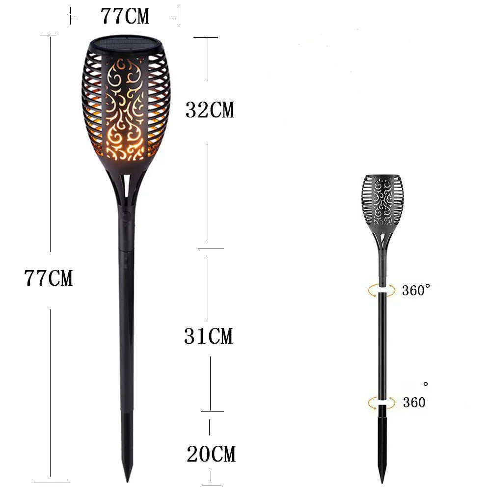 LED solar flame flickering lawn lamp with 96 warm white LEDs, 83cm tall, black finish, on a lawn with ground spike