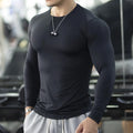 Men's black slim-fit fitness tights with long sleeves for running or gym workouts