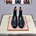 Men's black high-top leather business casual shoes with a cowhide upper and leather sole.