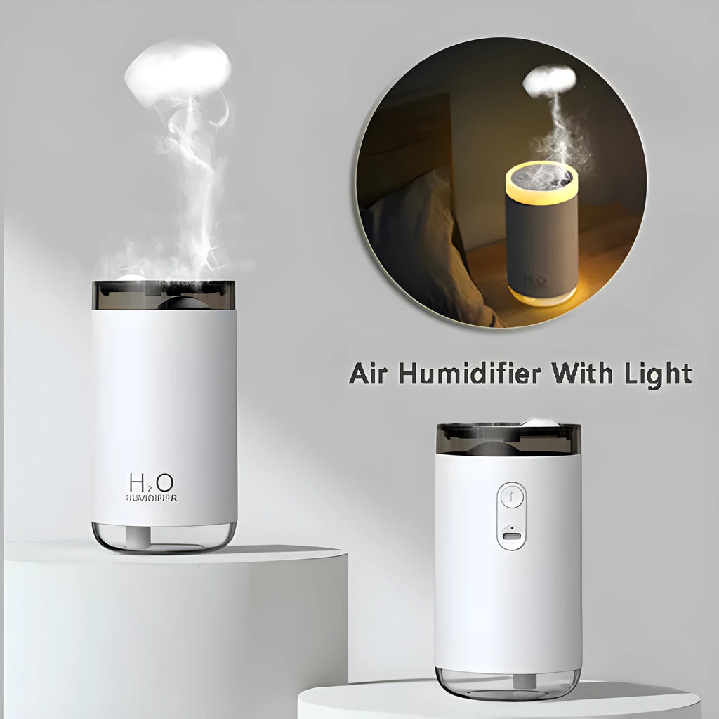 Blue jellyfish-shaped USB humidifier emitting smoke ring mist with warm night light on, placed on a wooden desk.