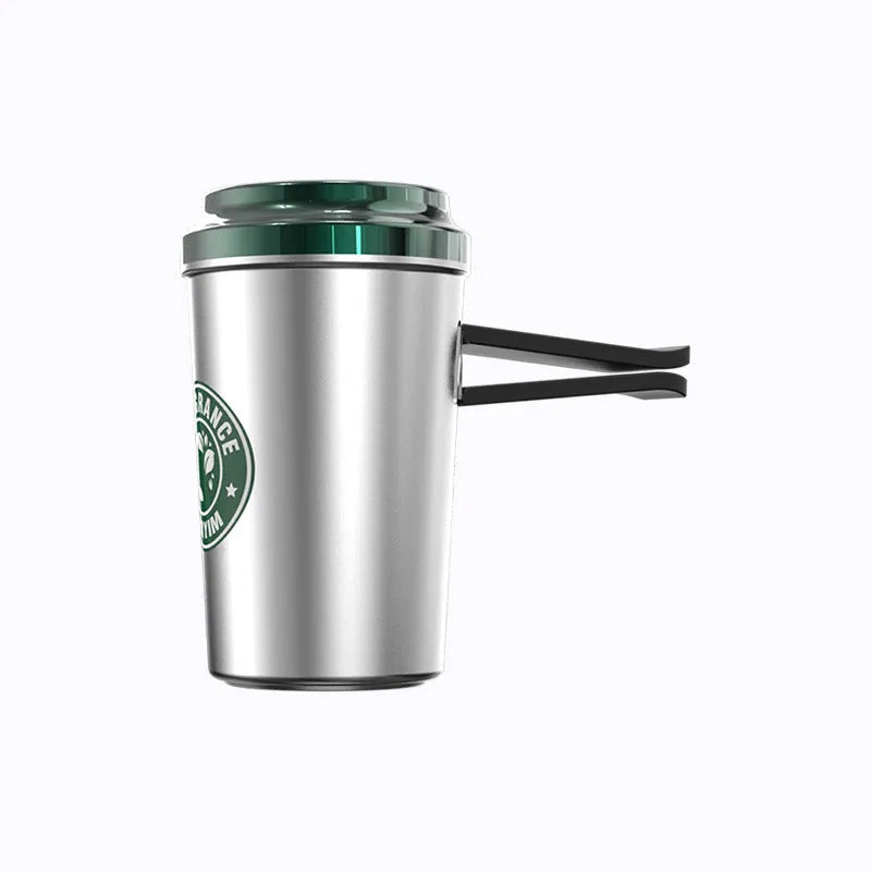 Silver alloy coffee cup shaped solid Gulong perfume seat with natural plant extract on a flat surface