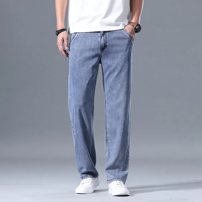 Men's loose straight-leg casual jeans in lyocell fabric, shown in light blue colour.
