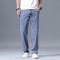 Men's loose straight-leg casual jeans in lyocell fabric, shown in light blue colour.