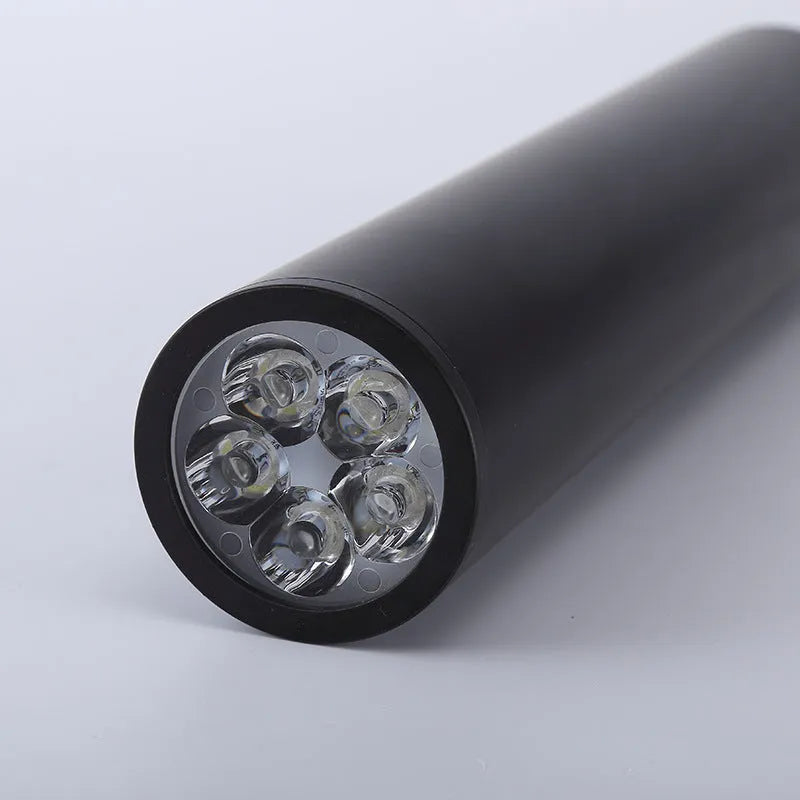Round black surface-mounted LED ceiling downlight spotlight in modern style.