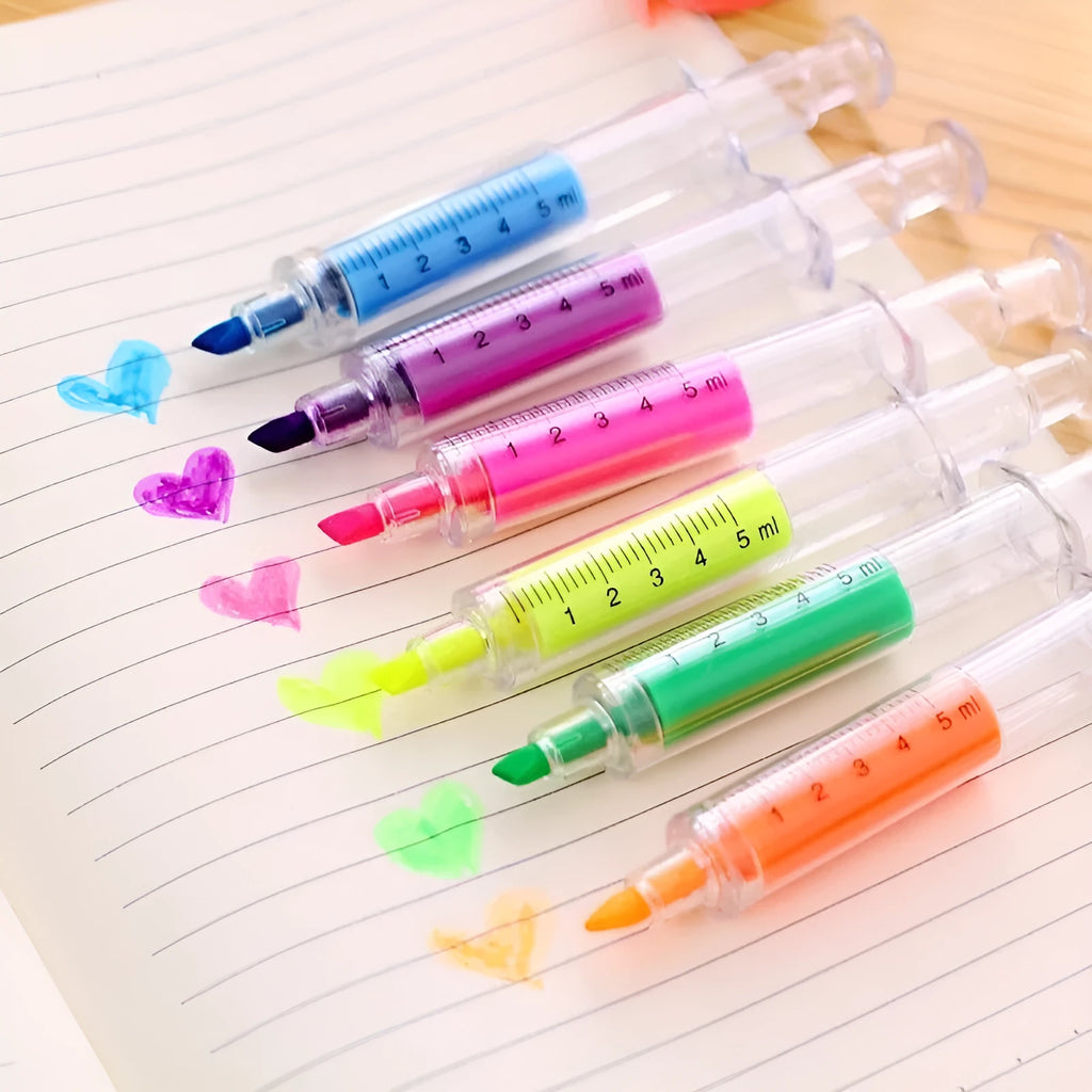 Six syringe-shaped fluorescent highlighter pens in red, orange, blue, yellow, green, and purple with oblique brush tips