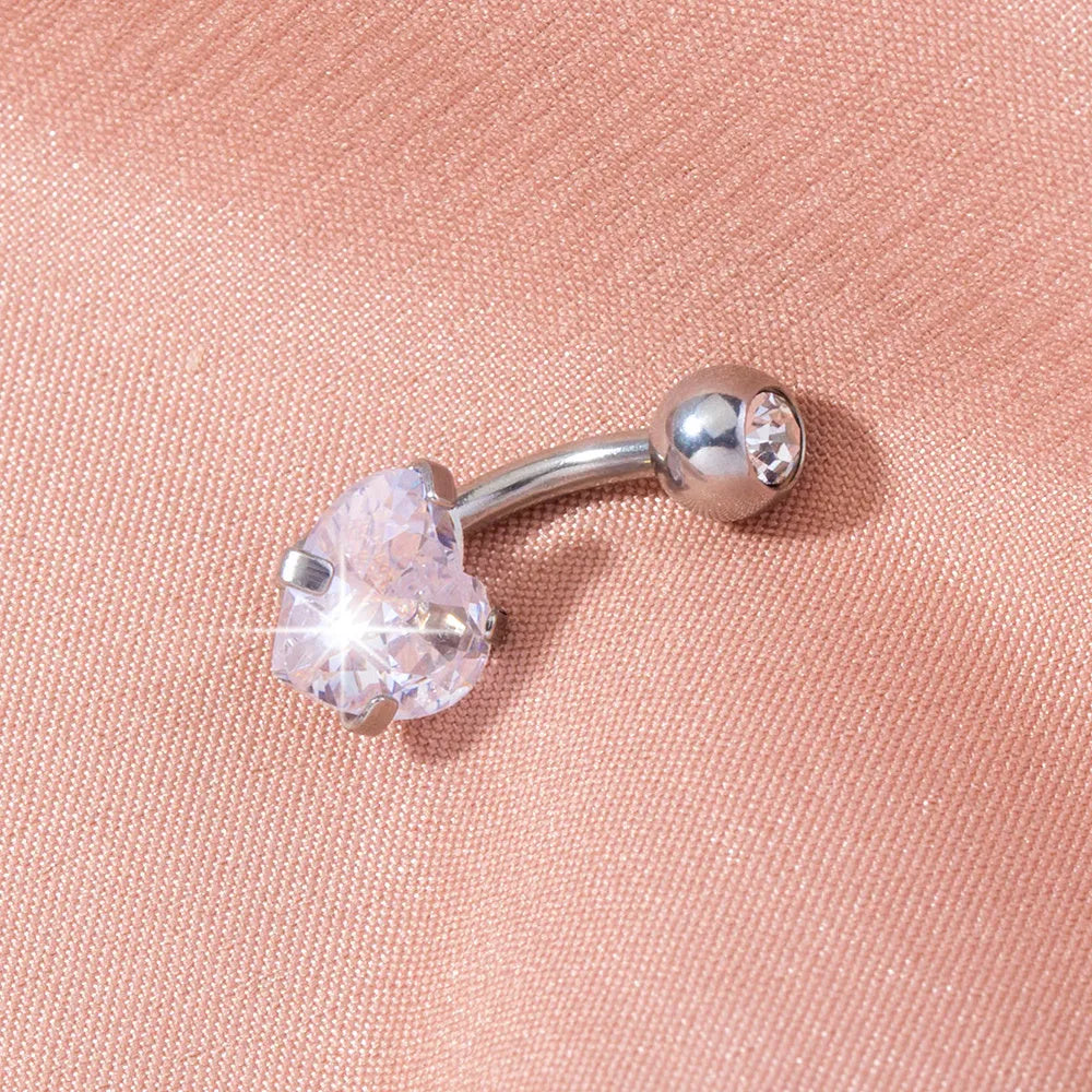 Stainless steel heart-shaped zircon navel pin, 0.8 cm wide and 1.8 cm tall, on white background