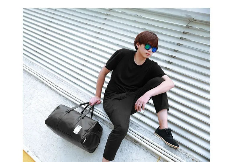 Black waterproof sports bag with separate shoe compartments and diagonal straps in two size options