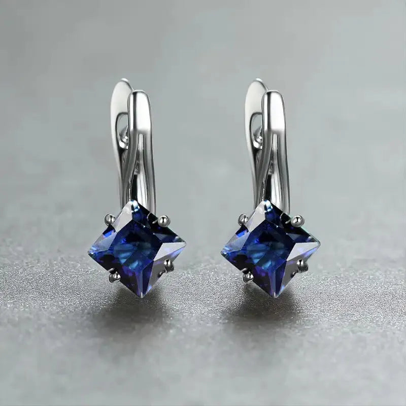 Copper diamond design earrings with inlaid zircon stones in blue, green, and colour options.