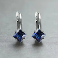 Copper diamond design earrings with inlaid zircon stones in blue, green, and colour options.