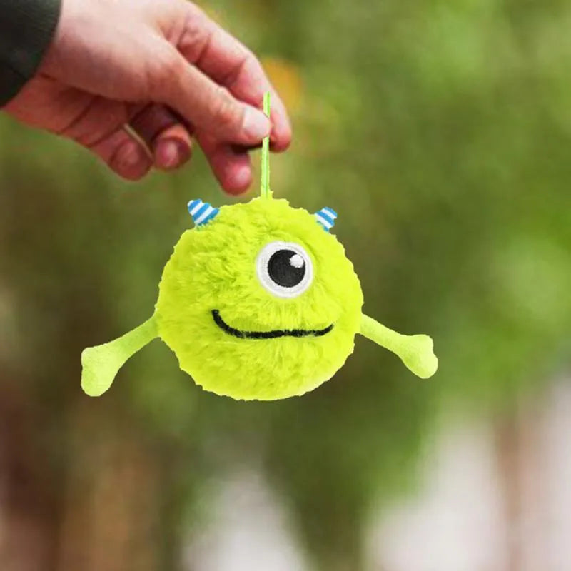Green interactive dog toy ball with sound activation for puppy teething and dental care