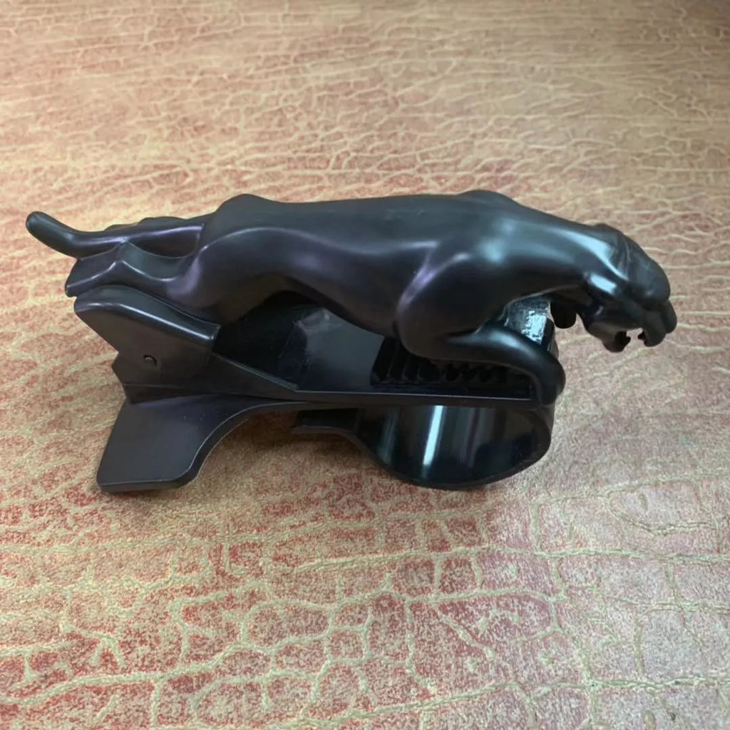 Black ABS car mobile phone holder with a 360-degree rotatable bracket mounted on a car dashboard
