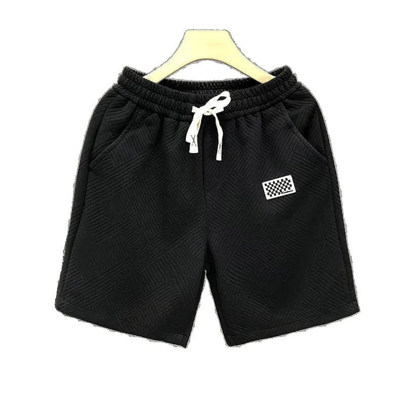 Casual solid-colour polyester sports shorts with micro elasticity on a mannequin.