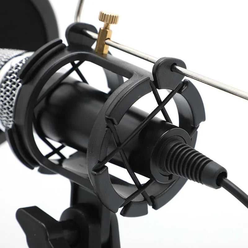 Black mini condenser microphone mounted on aluminium stand with 3.5mm and USB cables for live broadcasting