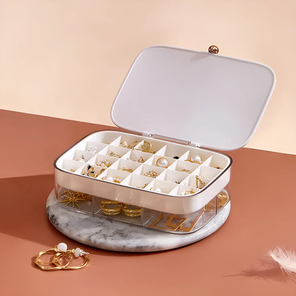 Green modern minimalist multi-layer jewelry storage box with internal compartments.