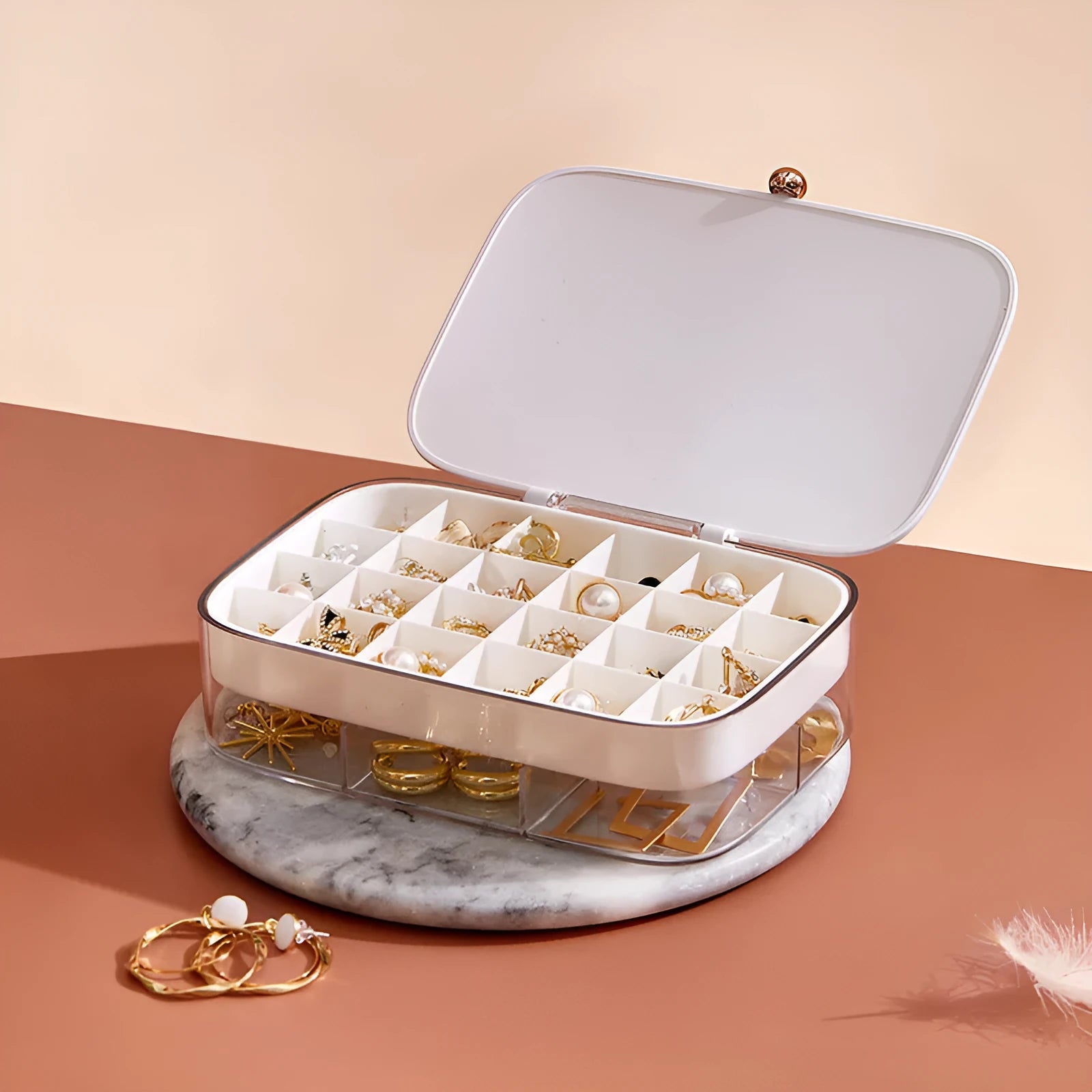 Green modern minimalist multi-layer jewelry storage box with internal compartments.