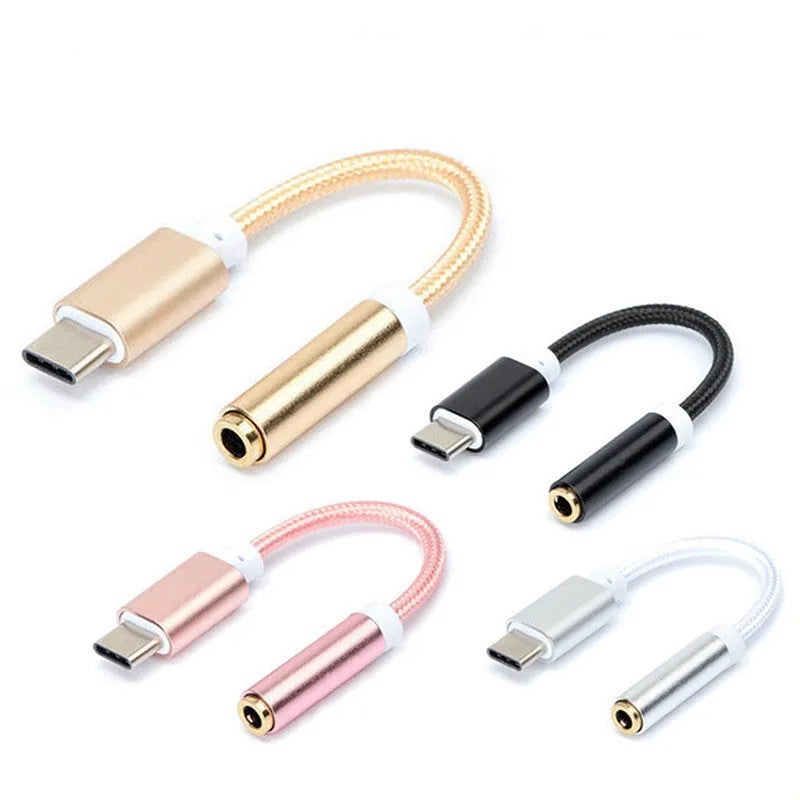 Close-up of a short black nylon braided Type-C to 3.5mm female headphone adapter cable.