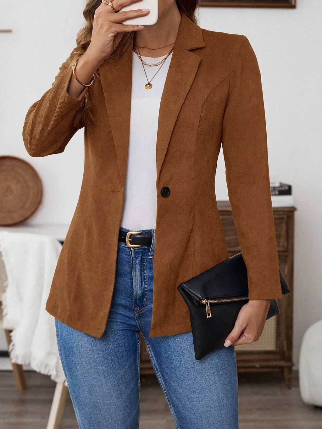 Brown single-breasted lapel coat for men with long sleeves, shown on a hanger.