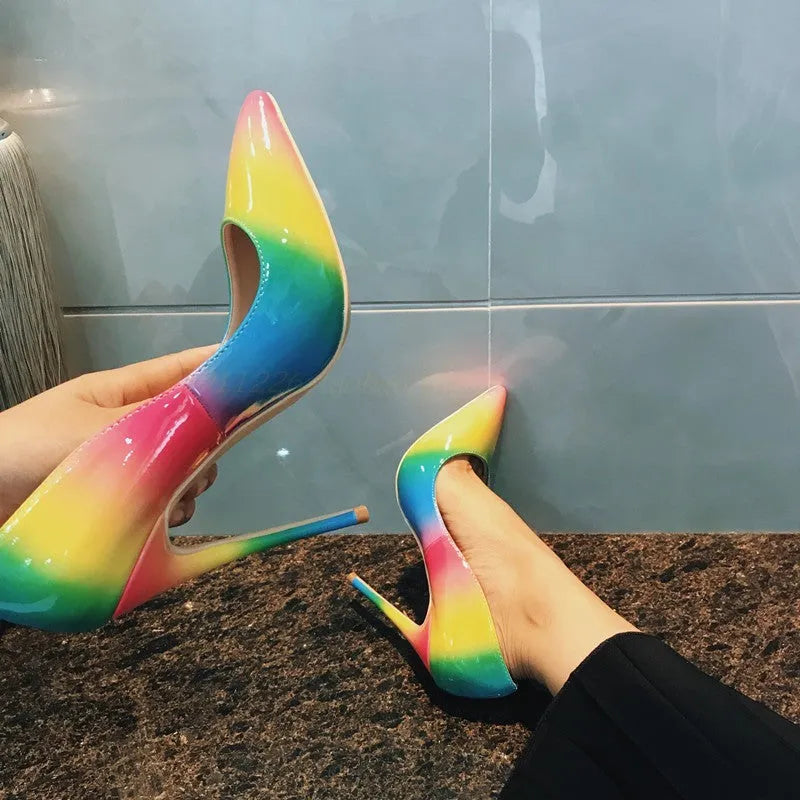 Rainbow multicolour patent leather women's high heel shoe with thin heel and pointed toe.