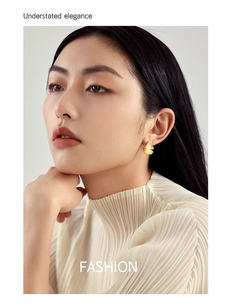 925 sterling silver stud earrings with 14k gold plated ginkgo biloba leaf design in gold colour