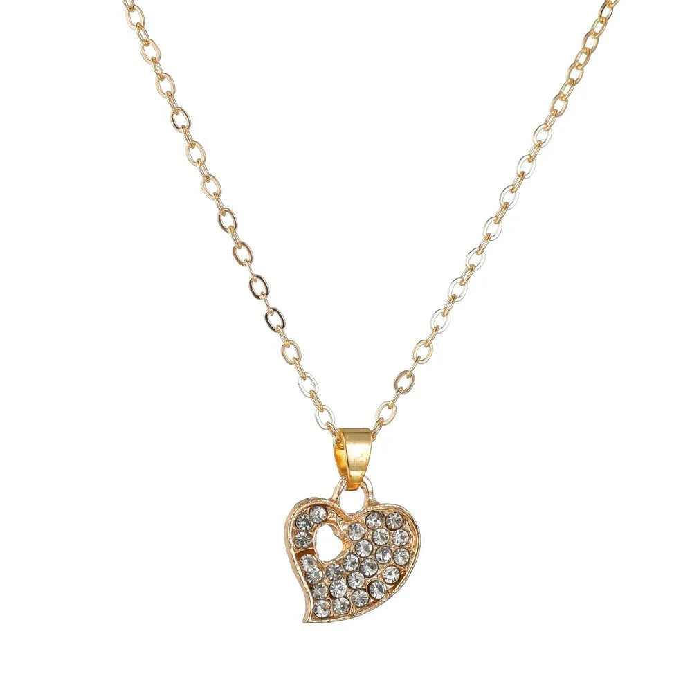 Gold alloy jewellery set with love heart, water drop, and bell pendants including earrings, necklace, and bracelet