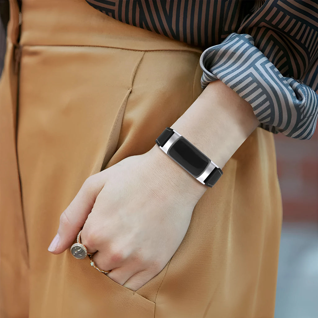 Genuine brown cowhide leather replacement strap for Fitbit Charge 5 and Charge 6 smart watches on a wrist.