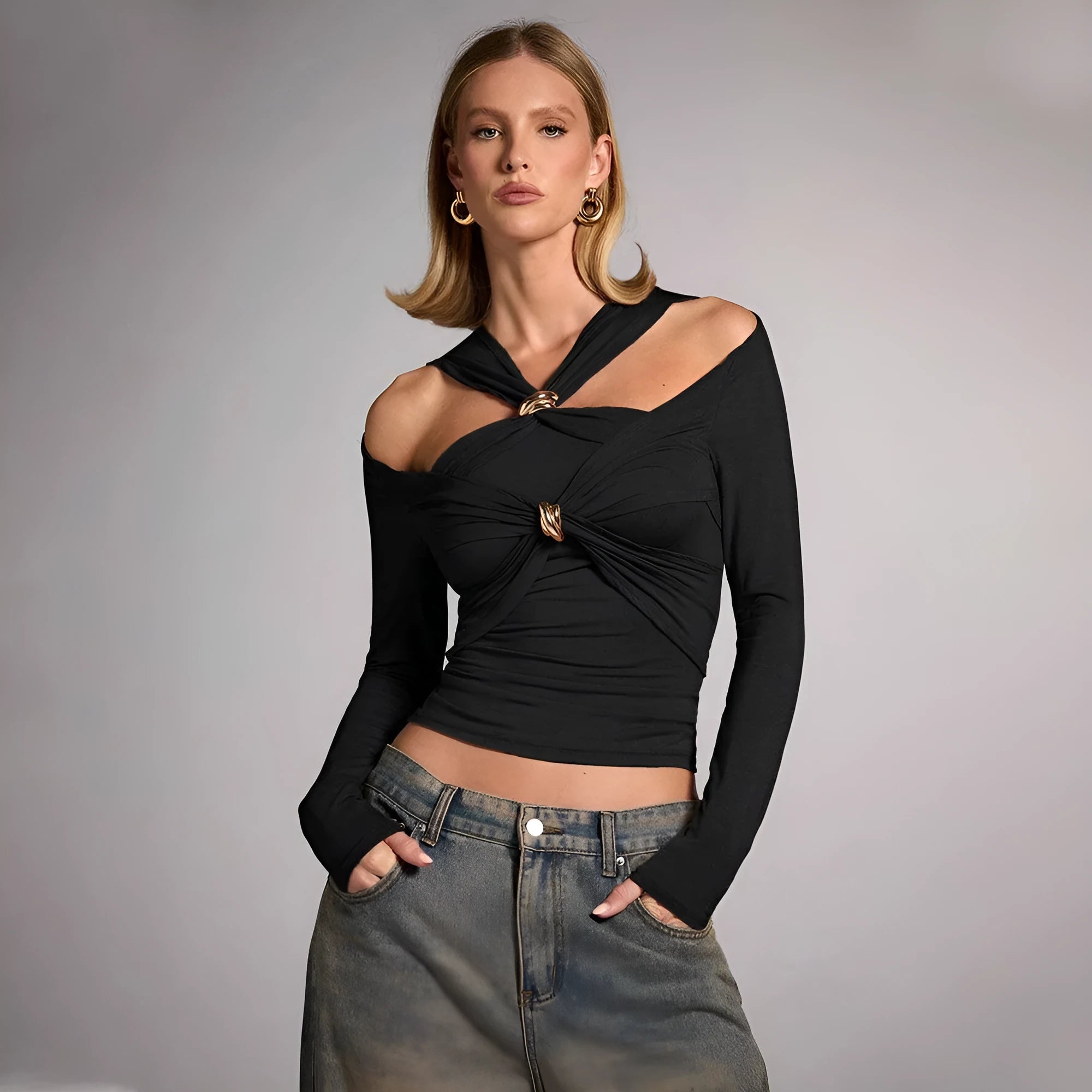 Women's black halter top with shoulder-baring neckline, long sleeves, and slim fit silhouette
