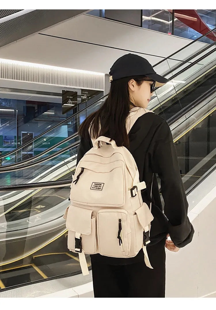 Soft nylon student backpack in black colour with computer compartment and three-dimensional pockets