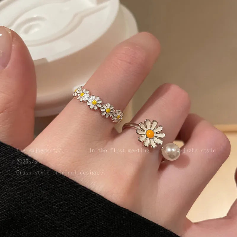 Little Daisy women's twin opening ring set in copper, one with a pearl and one plain.