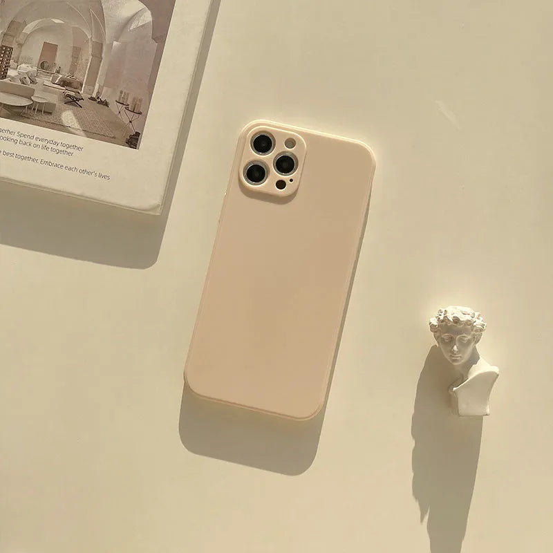 Frosted silicone phone case for iPhone 14 in slate blue colour showing matte texture and precise cutouts.