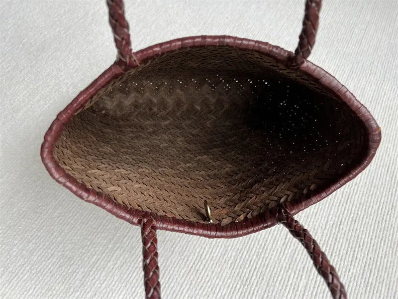 Woven vintage cowhide leather tote bag with three-dimensional outer pockets showing brown colour