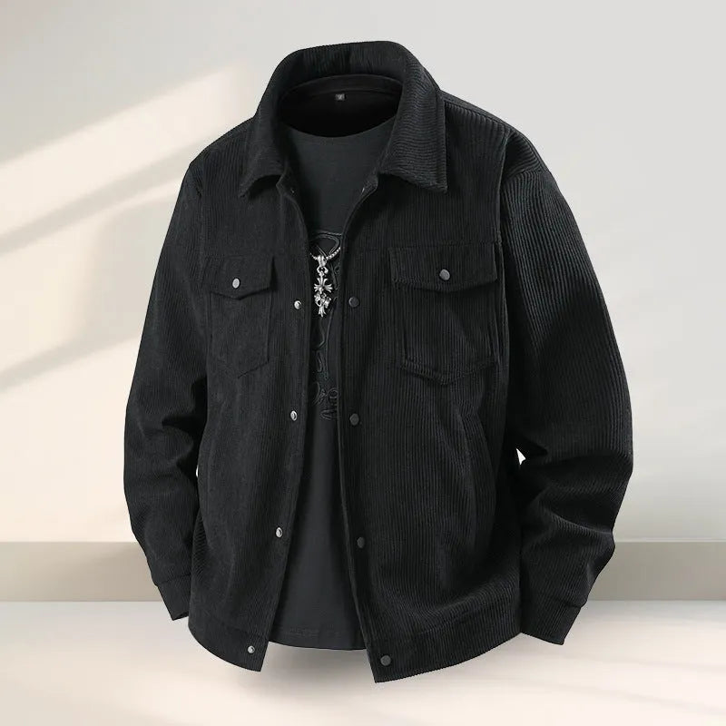 Man wearing a slim fit black coat with ruffle details, made from Lycra and Vinylon fabric.