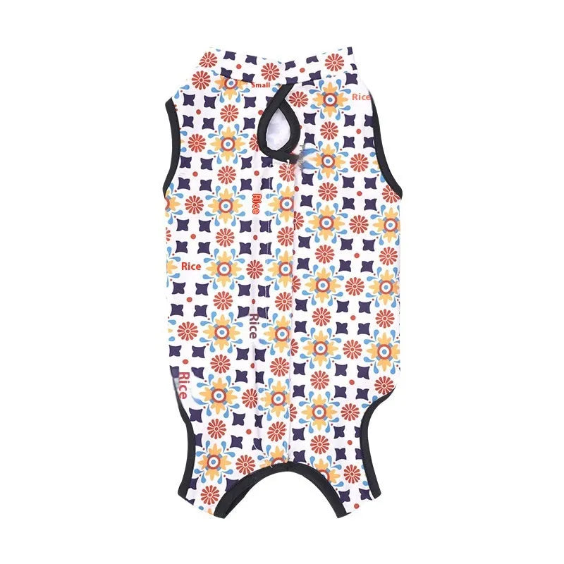 Cat wearing sterilisation recovery suit with Velcro closure in colourful print design