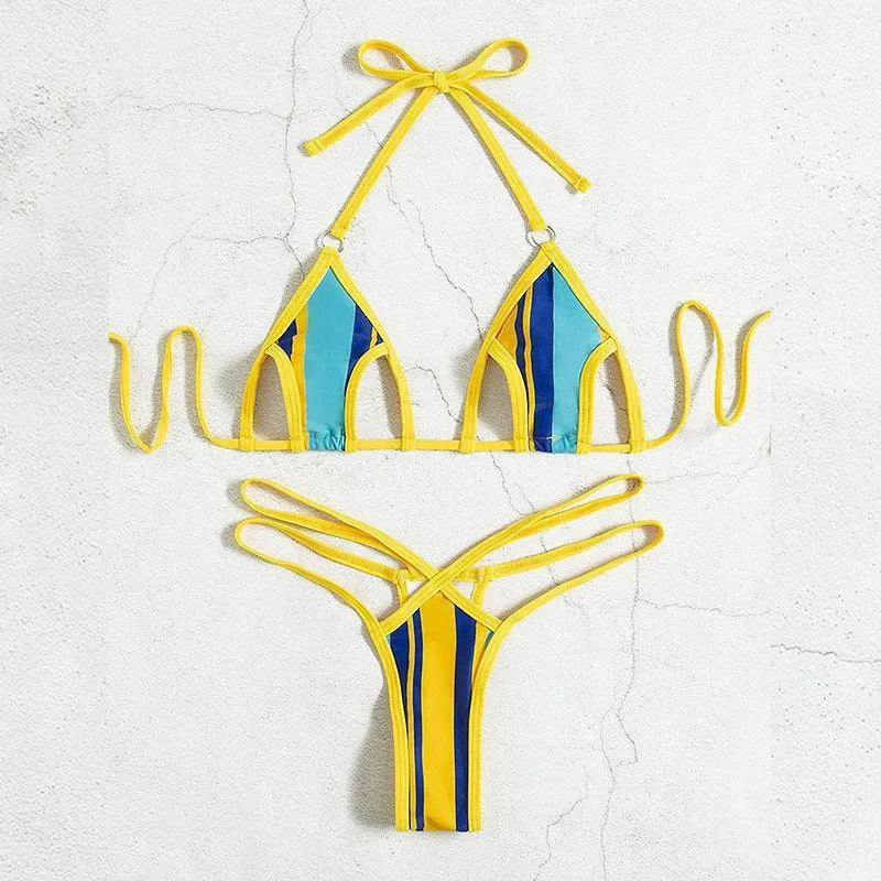 Yellow women's halter neck bikini with backless design and high-waist shorts on a neutral background.