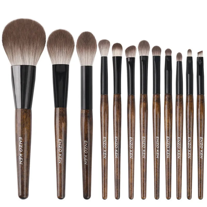 12-piece makeup brush set with wooden handles and a black PU storage bag.