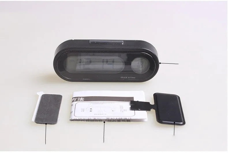 Black car electronic clock and thermometer with LED display on an adjustable dashboard bracket.
