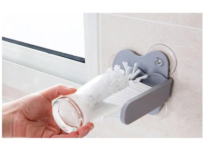 Grey rotating double-headed cup brush with suction cups for wall attachment