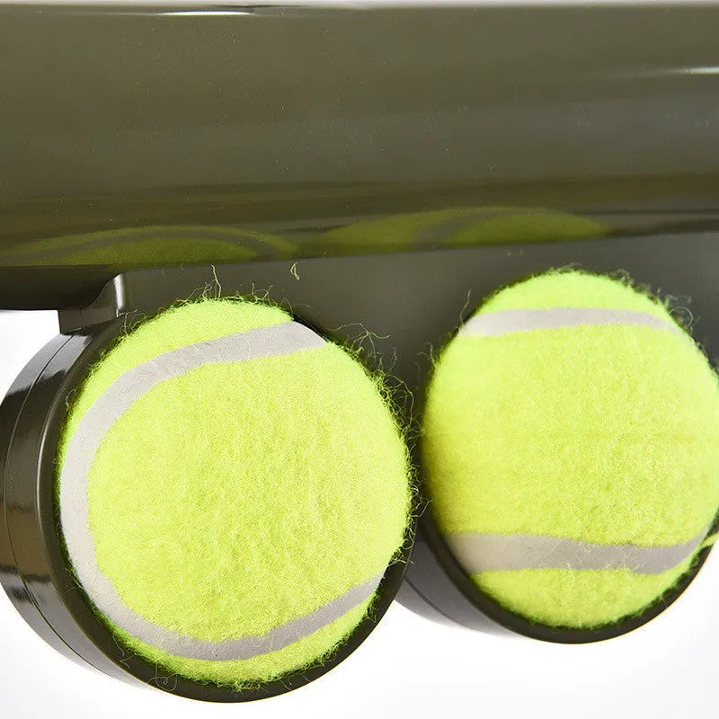 Black ABS plastic tennis ball launcher gun for pets with two tennis balls included