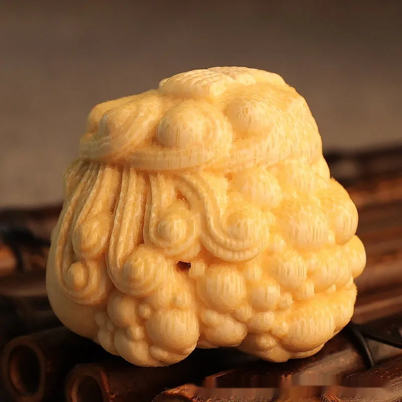 Solid bamboo golden toad princess ornament showing detailed hand carving and natural grain patterns