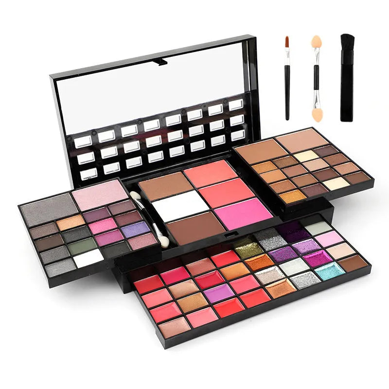 74 colour makeup palette open showing four layers of eyeshadow, lip gloss, blush and contour powders with included brushes.