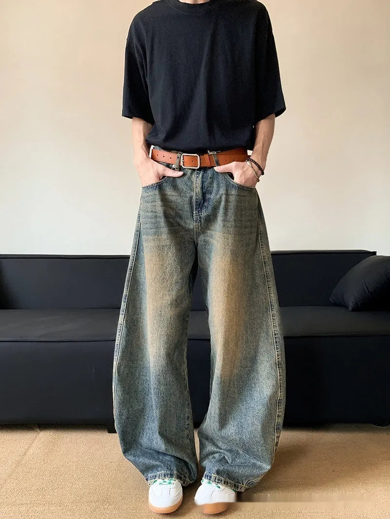 Men's retro blue distressed wide-leg jeans with micro-elastic cotton blend fabric showing distressed detailing