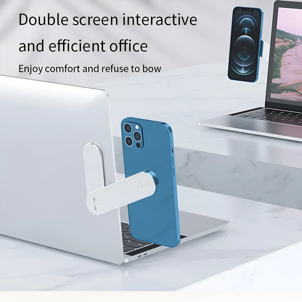 Black aluminium magnetic phone holder attached to side of silver laptop