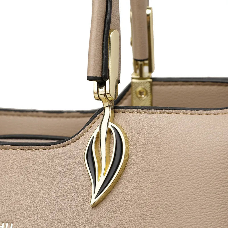 Women's black PU leather messenger bag with multi-layer shoulder design and sewing thread detailing