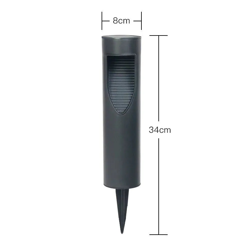 Black geometric abstract art solar-powered stainless steel garden lantern on grass.