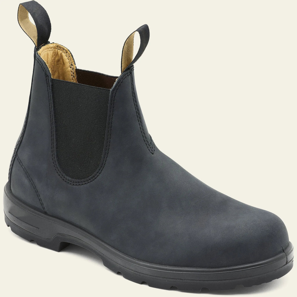 Vintage brown Chelsea boots with frosted PU upper and round toe on wooden floor
