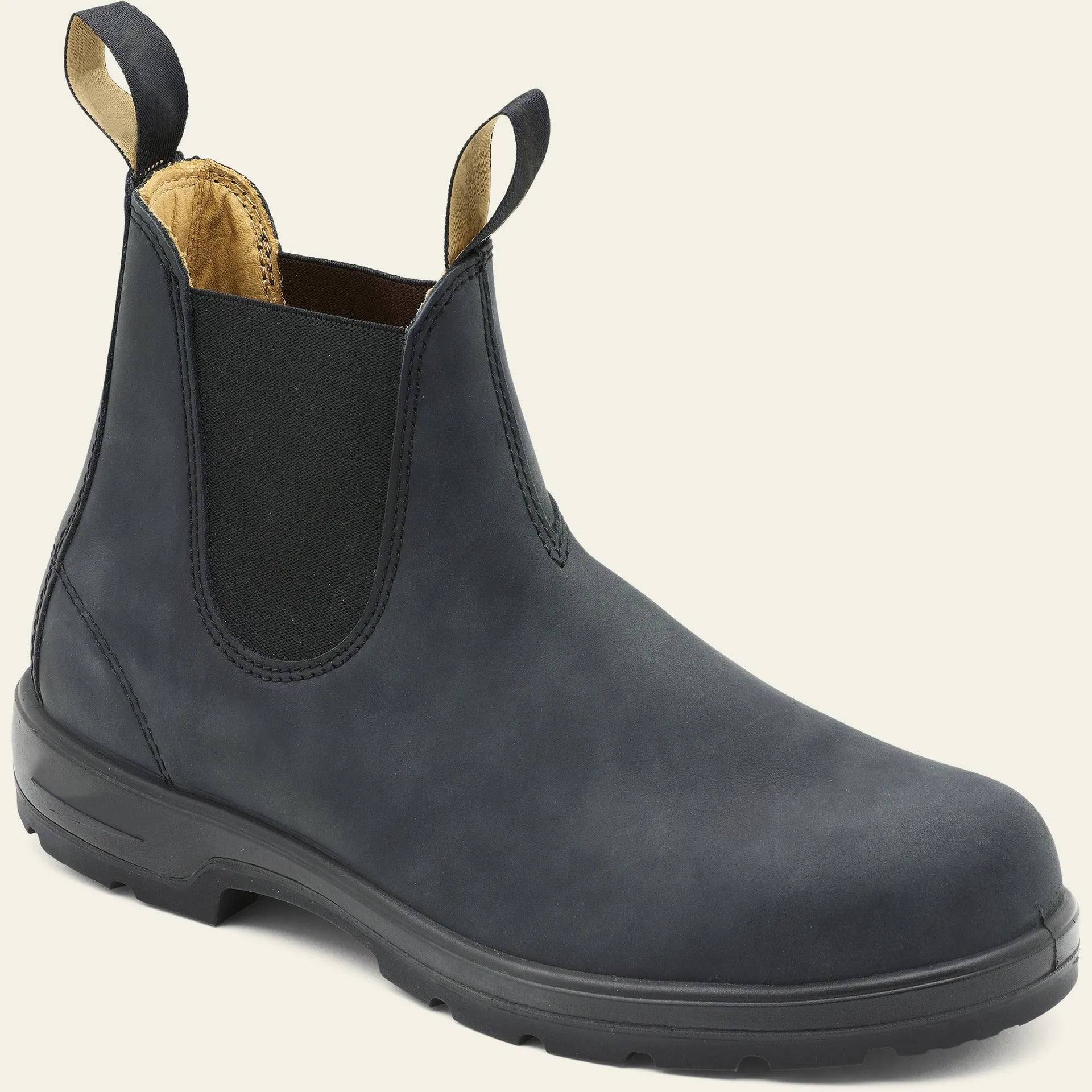 Vintage brown Chelsea boots with frosted PU upper and round toe on wooden floor