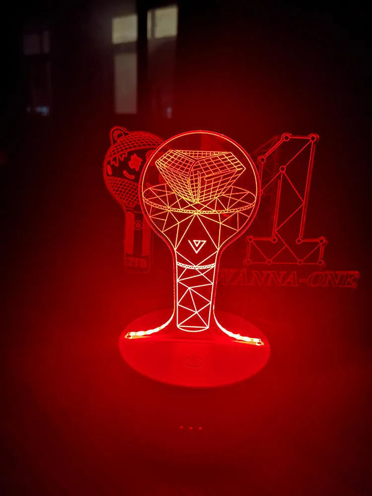 Clear acrylic display stand supporting 101 Tower Gem BTS lamp with universal voltage compatibility
